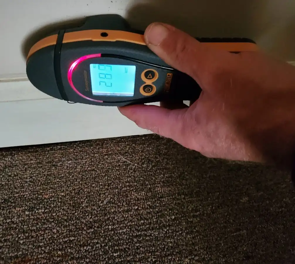 Moisture detection at baseboard during Storm Damage Restoration in North Coventry
